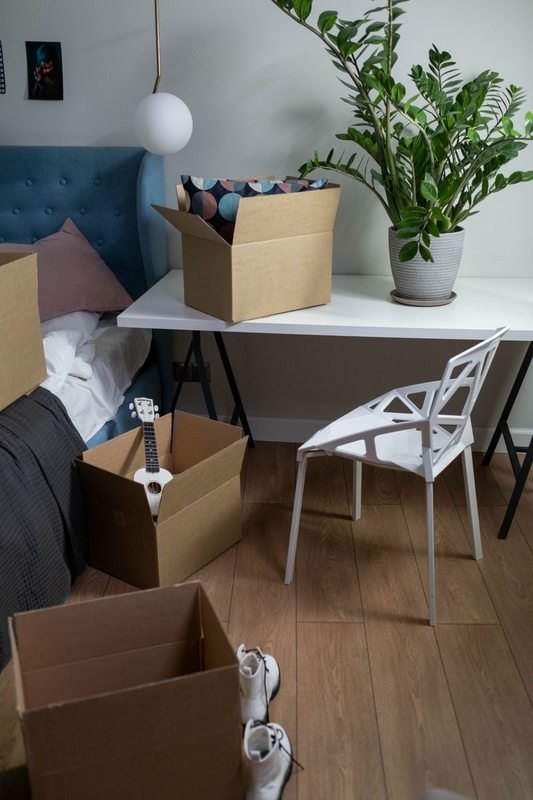 Archer's Moving mover carrying a sofa through a doorway
